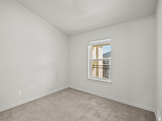 64 West 600 South, Unit C301 Springville, UT 84663 - Photo 20 of 40 Carpeted spare room with baseboards