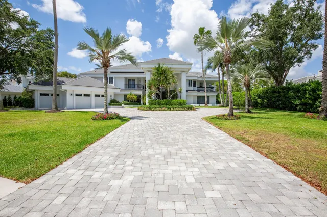 a view of a hallway with wooden floor and stairs