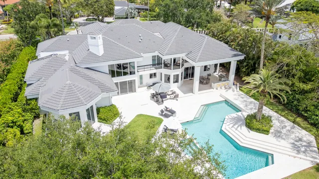 a patio with patio a table and chairs under an umbrella