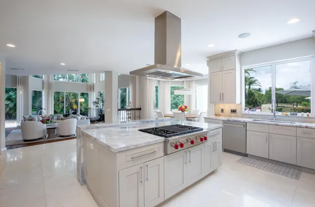 a living room with furniture and large window with outer view