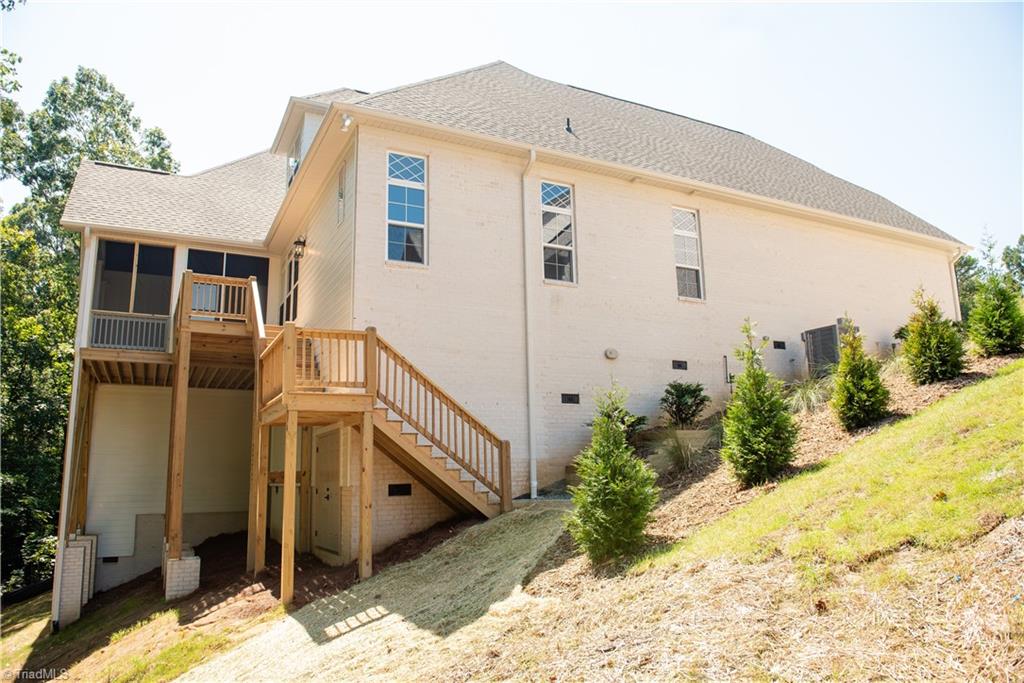 2844 St Giles Court High Point, NC 27262 - Photo 42 of 44 Left side of house w/ Deck and steps