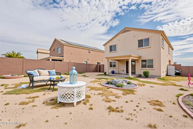 a view of a house with snow on the road