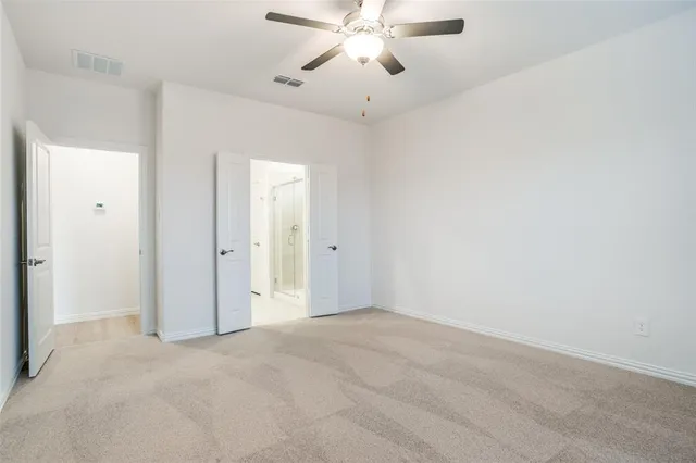 a spacious bathroom with a shower and a sink