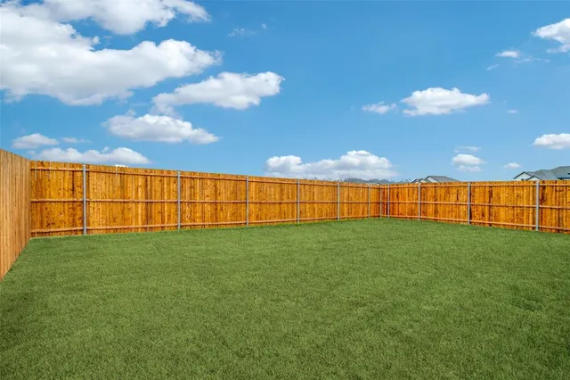 a view of a golf course with a lake