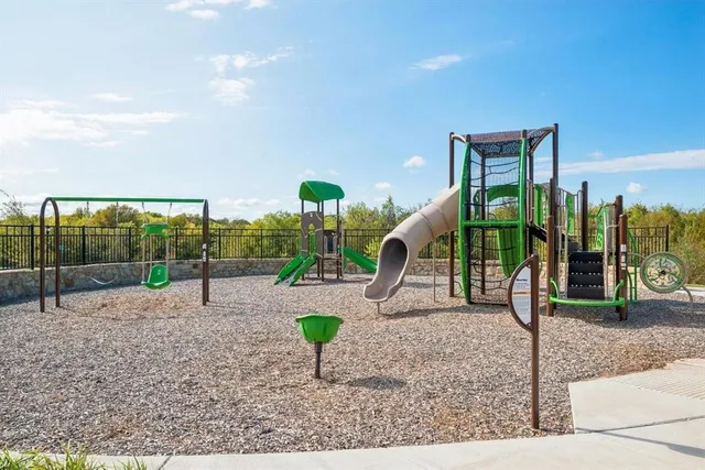 an aerial view of houses with a yard
