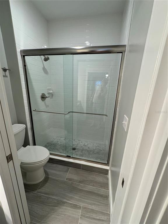 10000 Southwest 52nd Avenue, Unit 139 Gainesville, FL 32608 - Photo 11 of 16 a bathroom with a shower and a toilet
