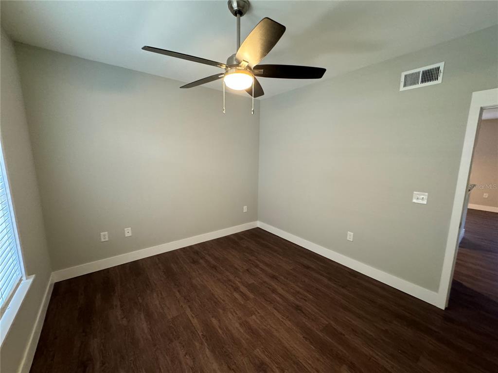 10000 Southwest 52nd Avenue, Unit 139 Gainesville, FL 32608 - Photo 10 of 16 wooden floor in an empty room