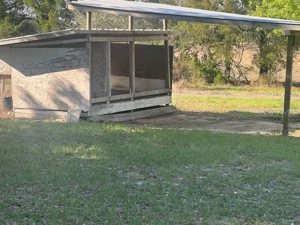 a view of a yard with an outdoor space
