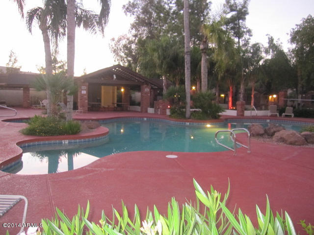 170 East Guadalupe Road, Unit 46 Gilbert, AZ 85234 - Photo 3 of 11 View of Pool area at Dusk with Lites on.