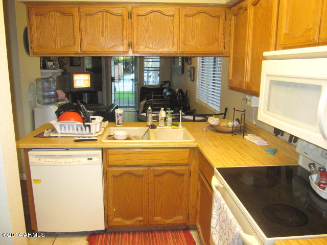 170 East Guadalupe Road, Unit 46 Gilbert, AZ 85234 - Photo 6 of 11 Kitchen facing Dining and Great