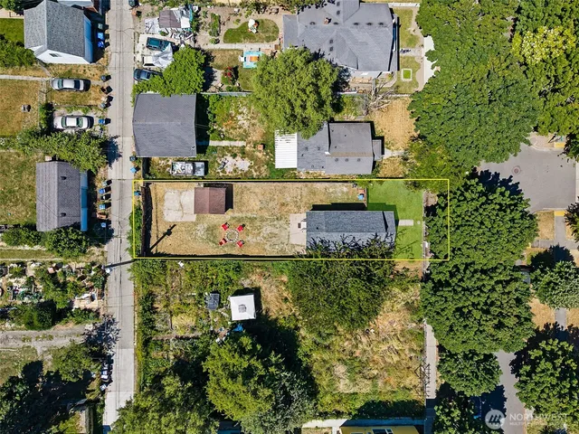 an aerial view of multiple houses with outdoor space