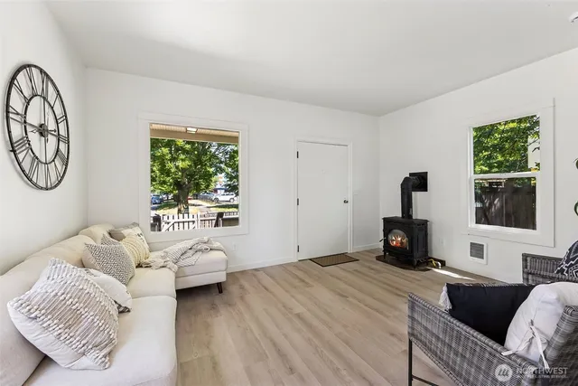 a bedroom with furniture and a window