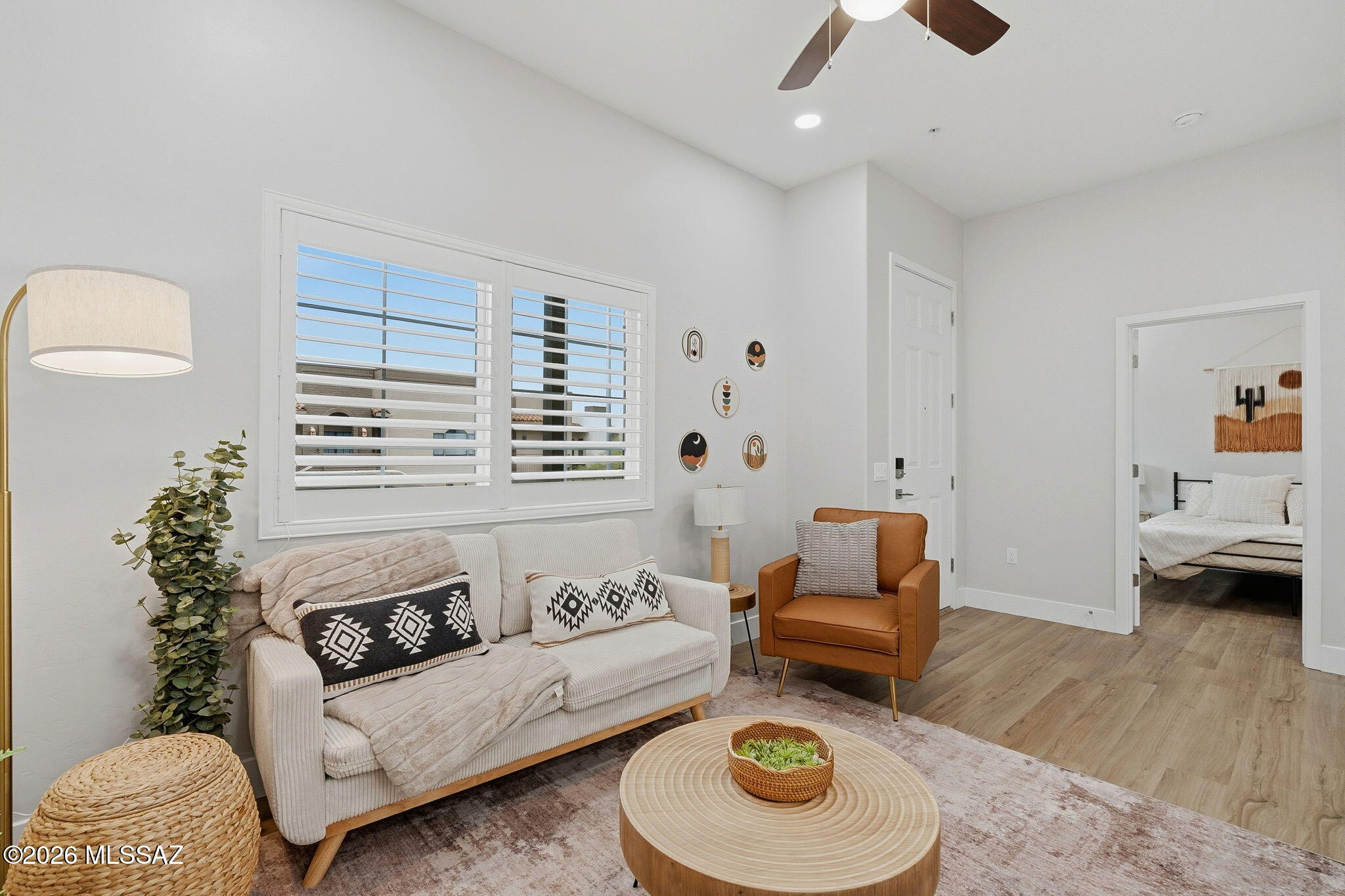 2020 East River Road, Unit 201 Tucson, AZ 85718 - Photo 3 of 10 a living room with furniture and a couch