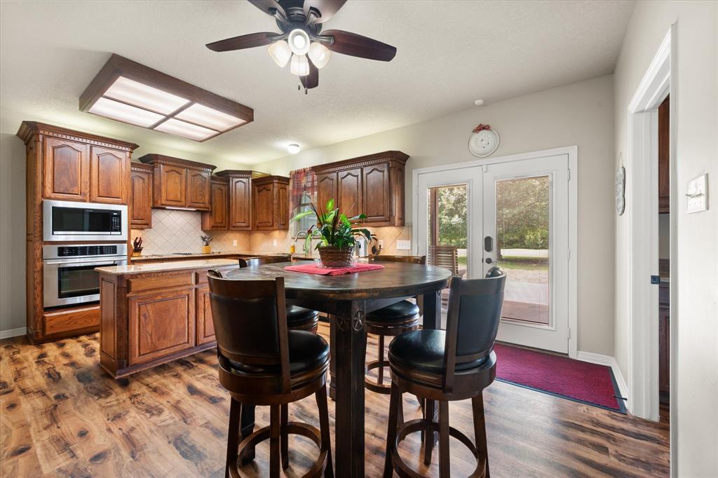 413 Rugged Drive Red Oak, TX 75154 - Photo 14 of 39 Breakfast area and kitchen overlook the gorgeous backyard