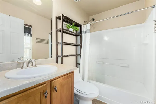 a view of a balcony with chair and front door