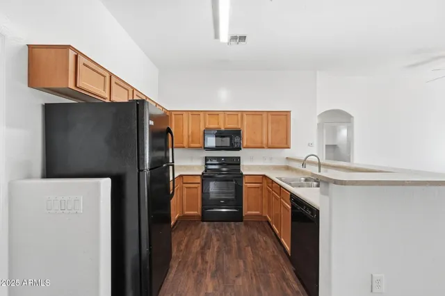 a kitchen with a refrigerator stove and microwave