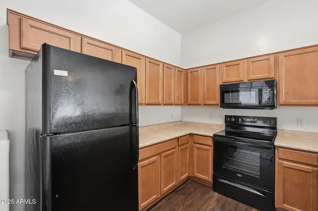 a kitchen with a sink stove and microwave