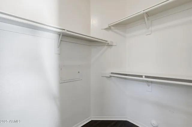 a bathroom with a sink a toilet and a large mirror