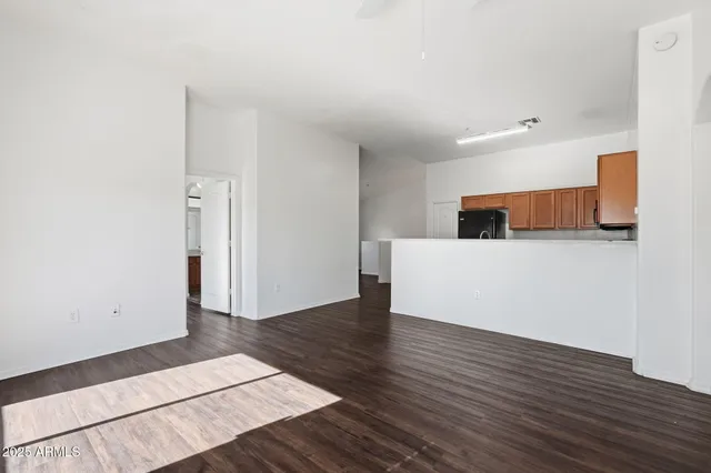 a bedroom with a large bed and a potted plant