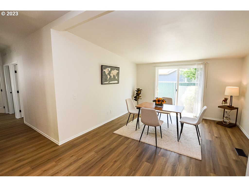 5332 Bridgewater Drive Eugene, OR 97402 - Photo 16 of 28 a view of a dining room with furniture and wooden floor