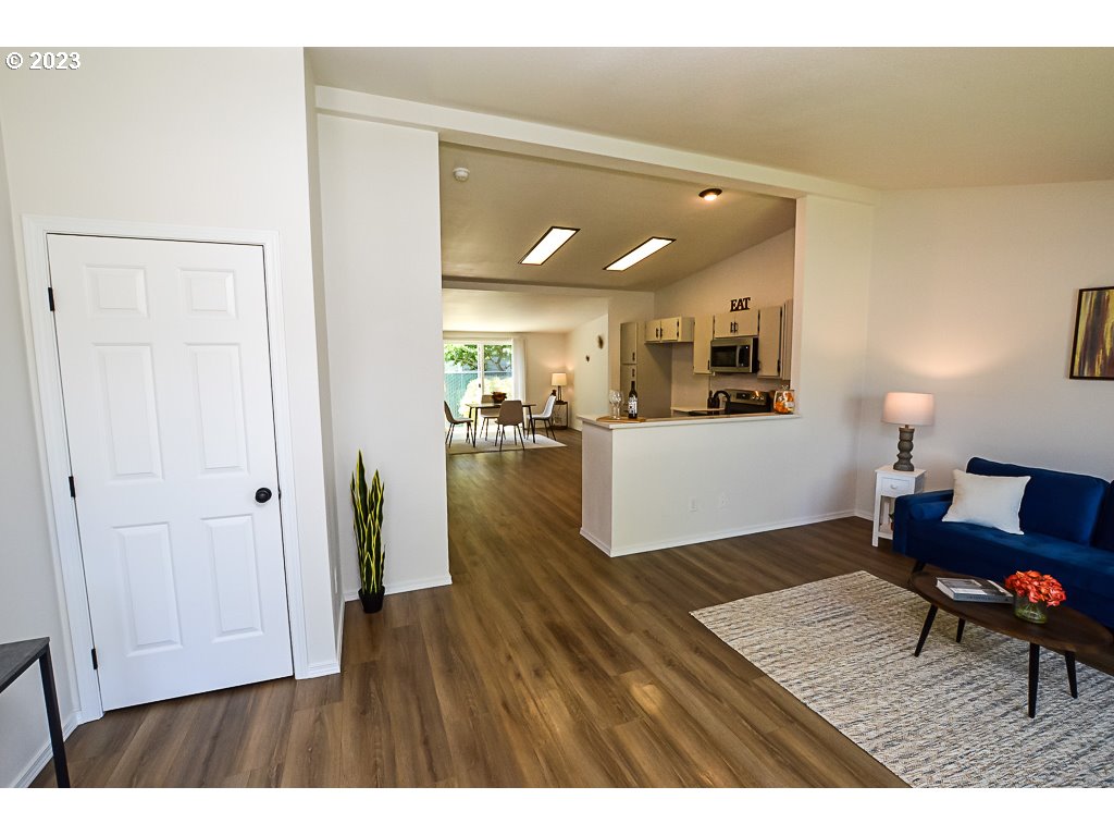 5332 Bridgewater Drive Eugene, OR 97402 - Photo 5 of 28 a living room with furniture and a wooden floor