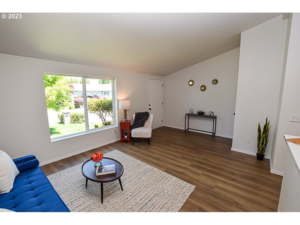 5332 Bridgewater Drive Eugene, OR 97402 - Photo 6 of 28 a living room with furniture and a wooden floor