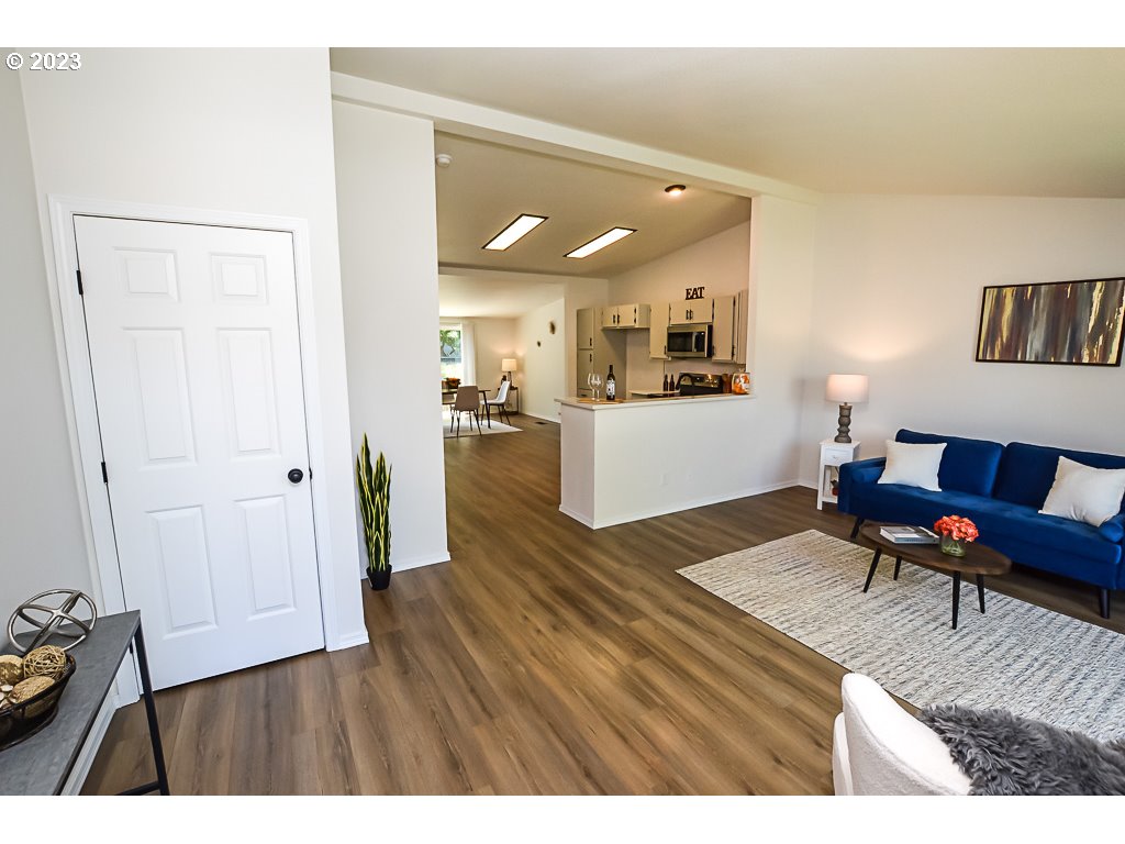 5332 Bridgewater Drive Eugene, OR 97402 - Photo 7 of 28 a living room with furniture and a wooden floor