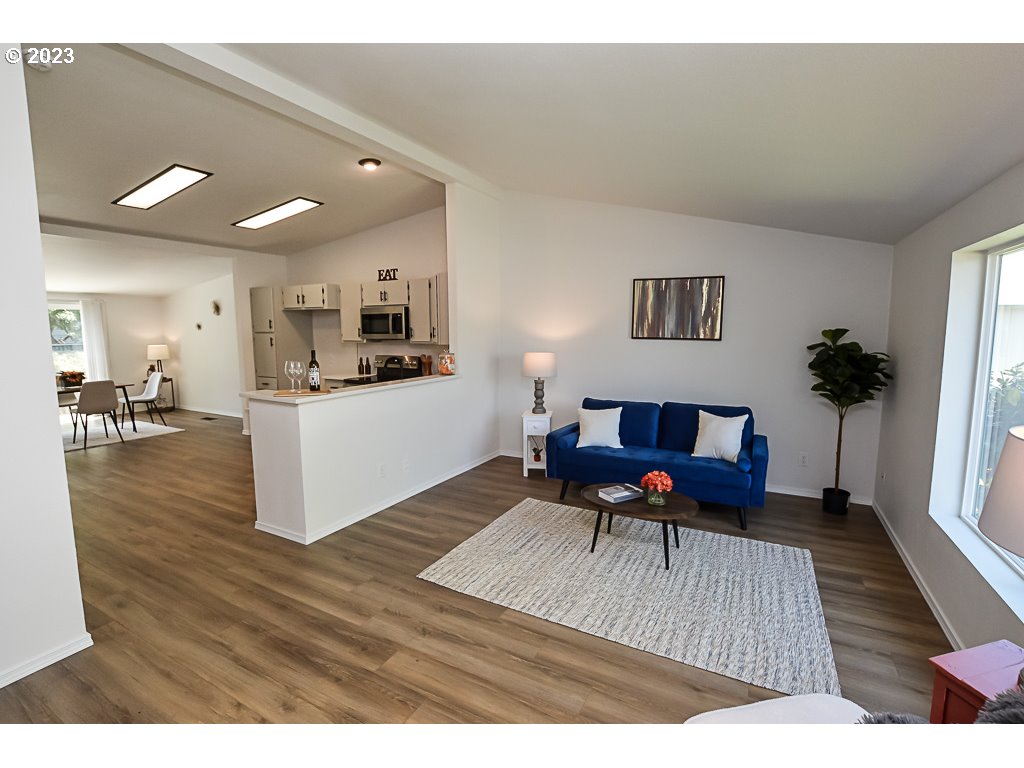 5332 Bridgewater Drive Eugene, OR 97402 - Photo 9 of 28 a living room with furniture and a wooden floor