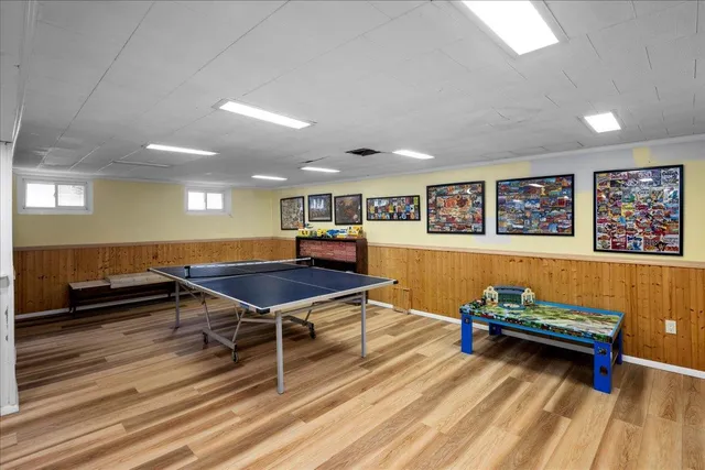 a living room with furniture a wooden floor and a table