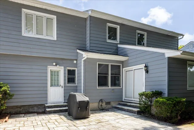a backyard of a house with seating space