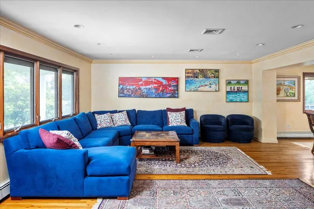 a living room with furniture rug and window