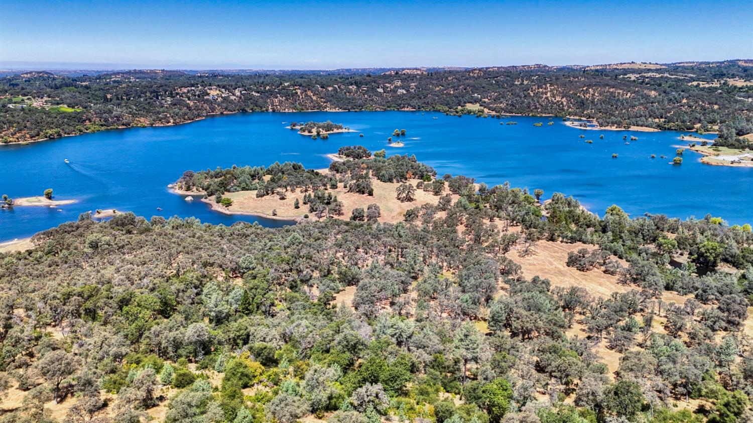 Acreage fronts a delightful cove of beautiful Folsom Lake.