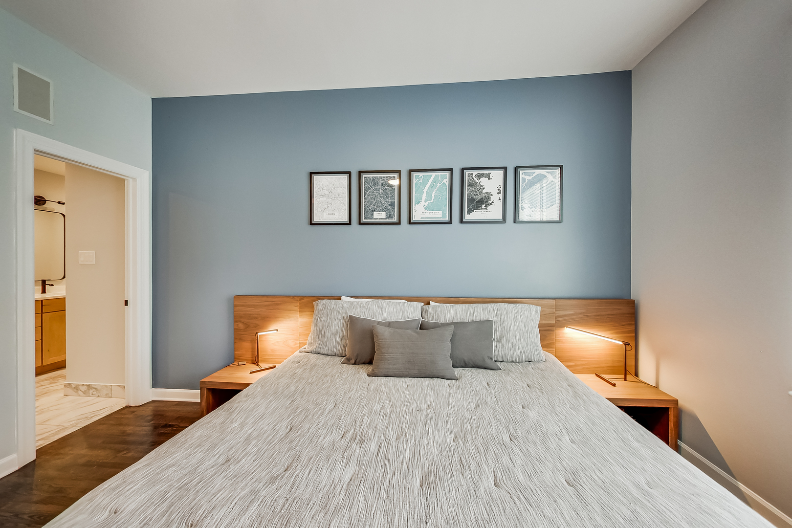 845 West Altgeld Street, Unit 2A Chicago, IL 60614 - Photo 14 of 24 a bedroom with a bed and lamp with wooden floor
