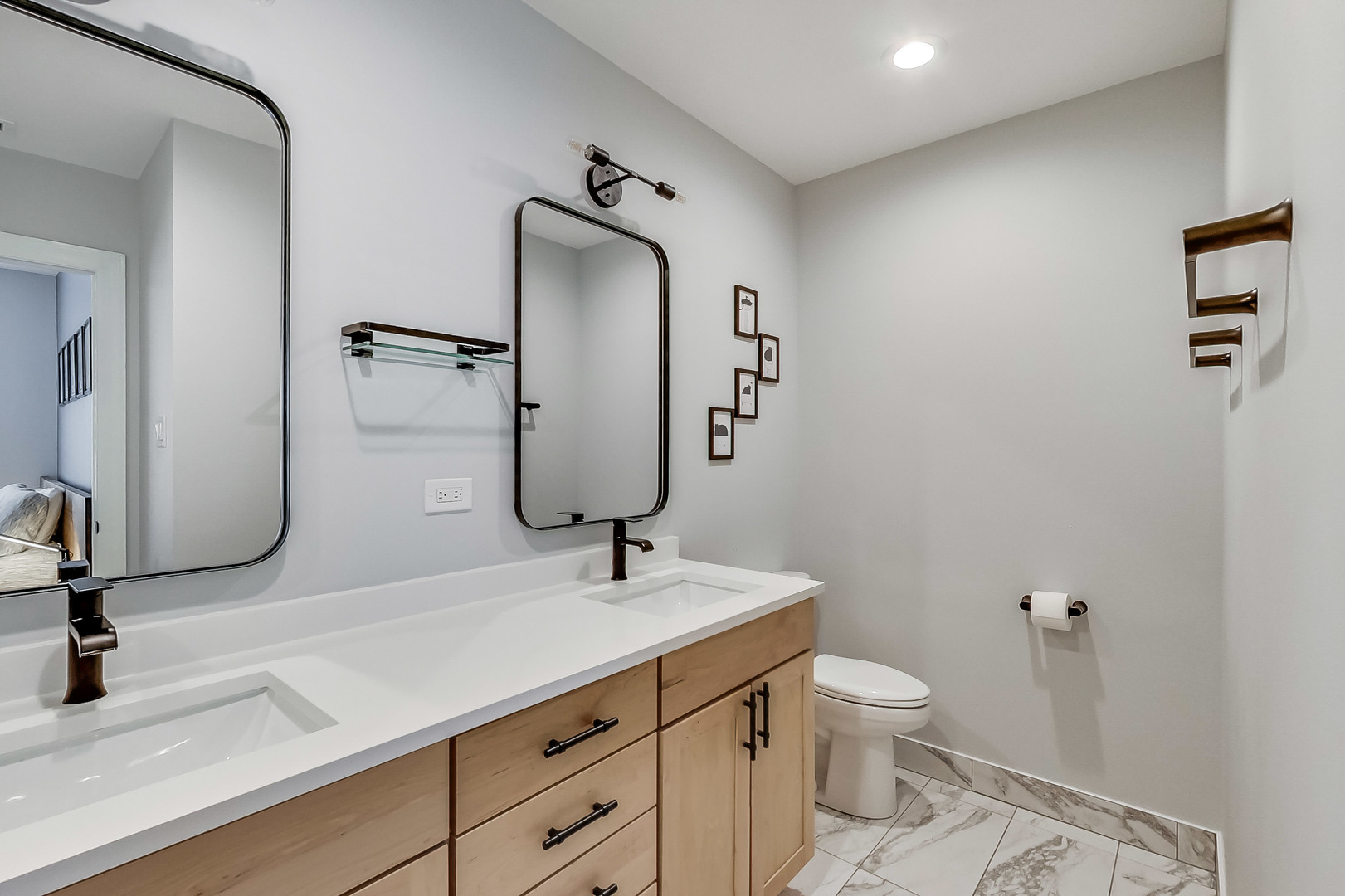 845 West Altgeld Street, Unit 2A Chicago, IL 60614 - Photo 17 of 24 a bathroom with a toilet sink and mirror