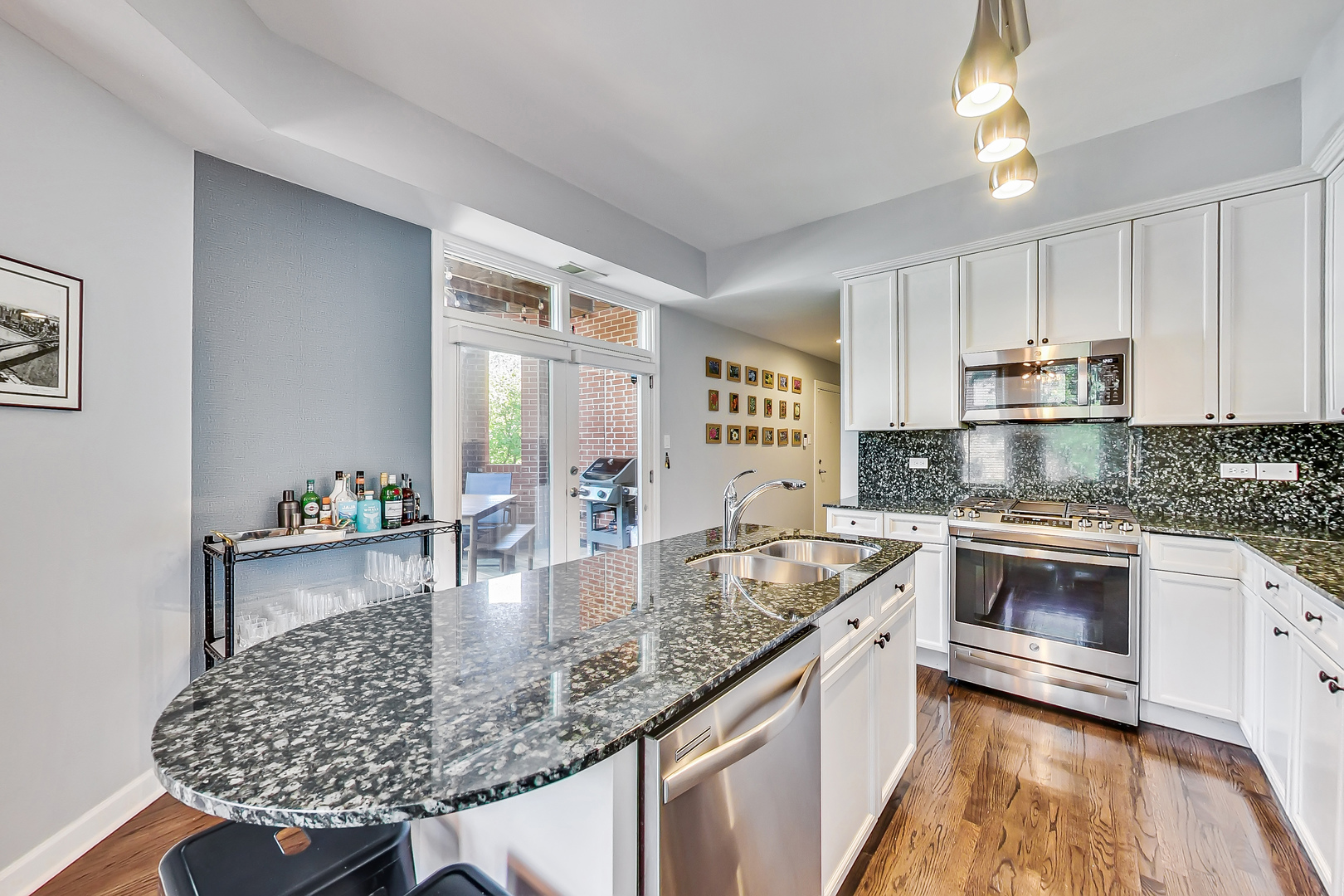 845 West Altgeld Street, Unit 2A Chicago, IL 60614 - Photo 10 of 24 a kitchen with stainless steel appliances granite countertop a sink stove and cabinets