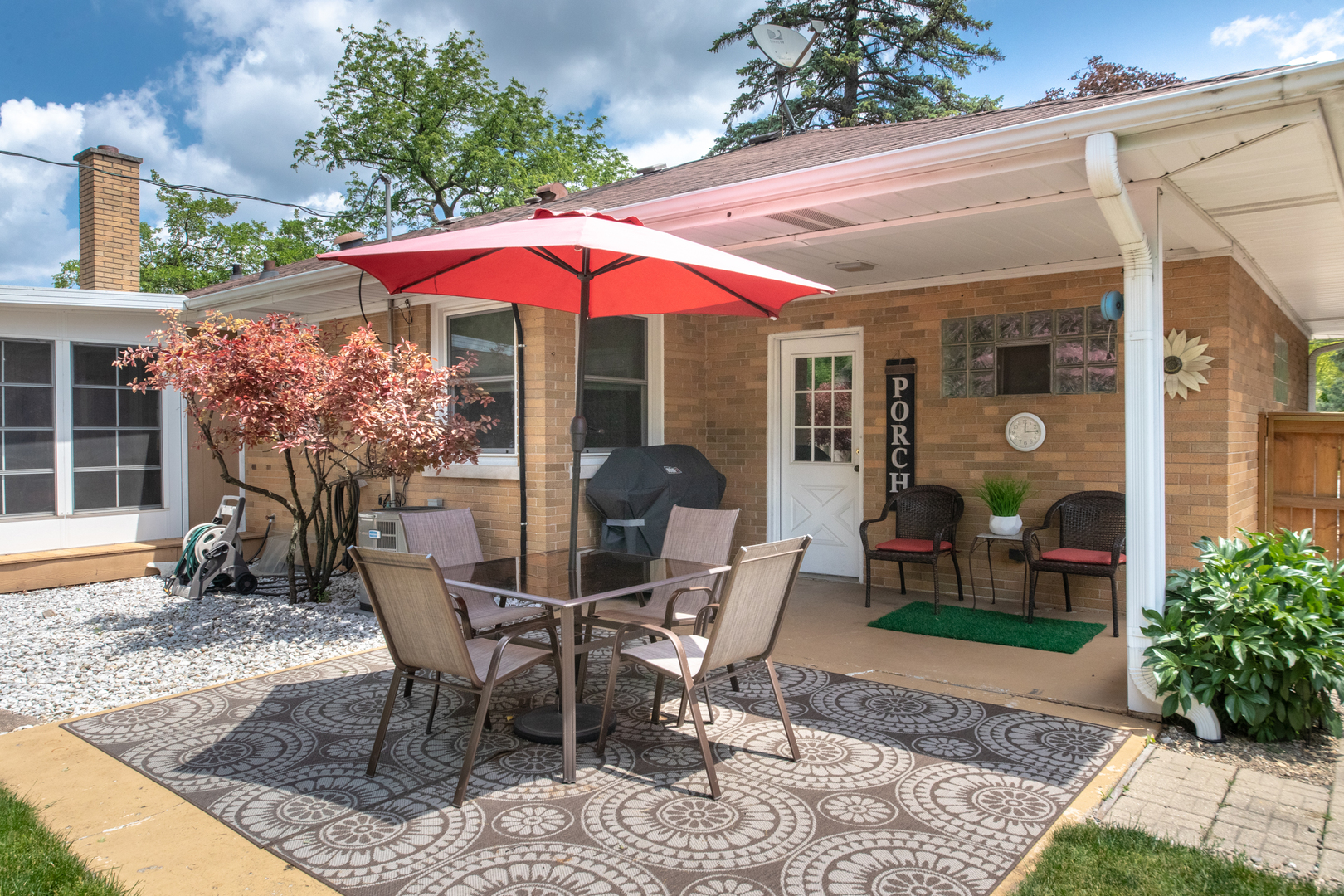 740 North Dee Road Park Ridge, IL 60068 - Photo 17 of 22 a patio with a table and chairs under an umbrella
