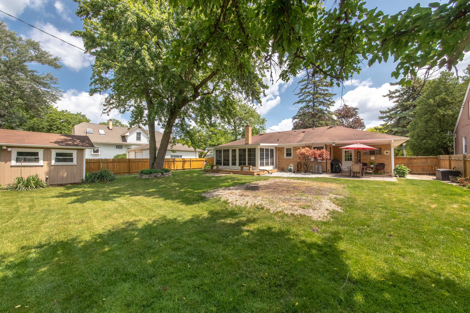 740 North Dee Road Park Ridge, IL 60068 - Photo 18 of 22 a front view of a house with a garden