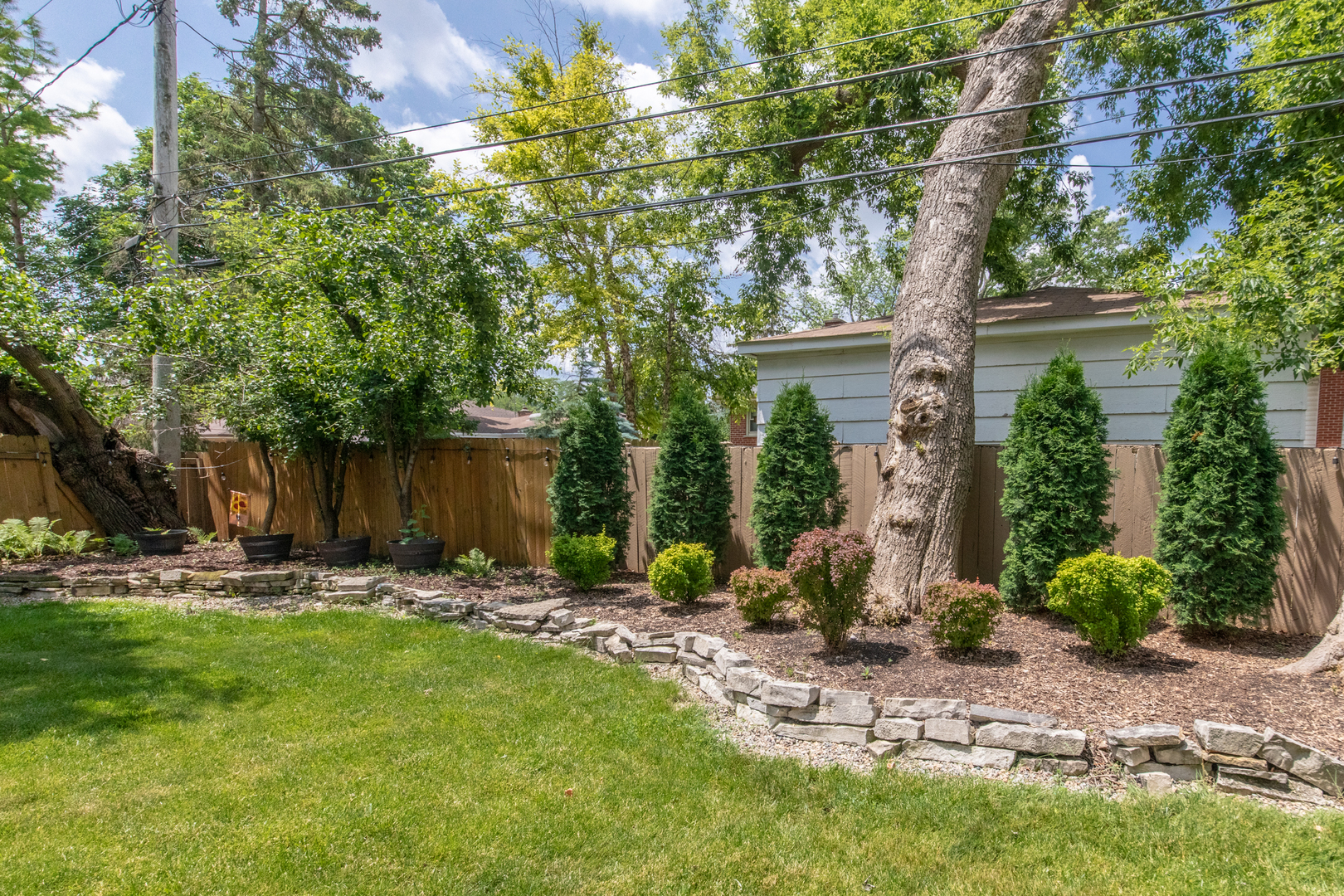 740 North Dee Road Park Ridge, IL 60068 - Photo 20 of 22 a view of a backyard with sitting area and tree