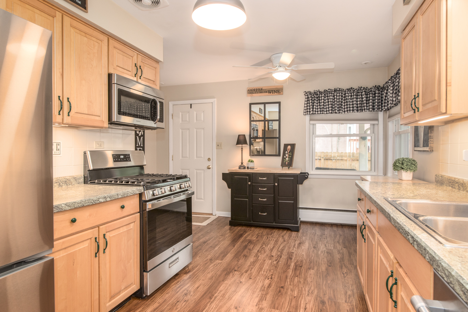 740 North Dee Road Park Ridge, IL 60068 - Photo 5 of 22 a kitchen with stainless steel appliances granite countertop a stove a sink and a refrigerator