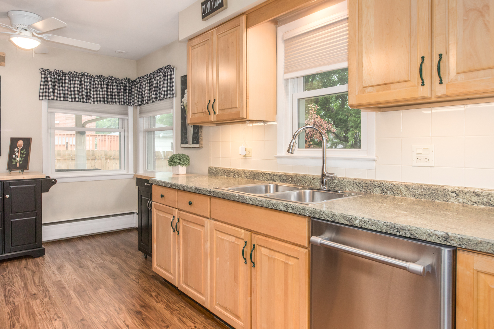 740 North Dee Road Park Ridge, IL 60068 - Photo 7 of 22 a kitchen with granite countertop cabinets stainless steel appliances a sink and a window