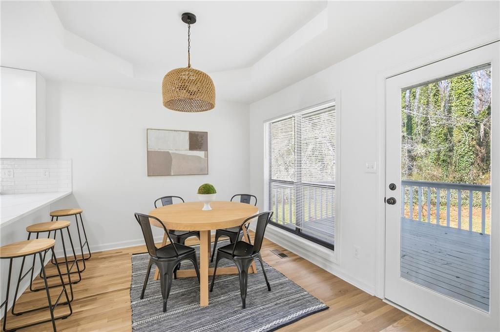 68 Winward Way Southeast Smyrna, GA 30082 - Photo 12 of 42 a dining room with furniture window and wooden floor