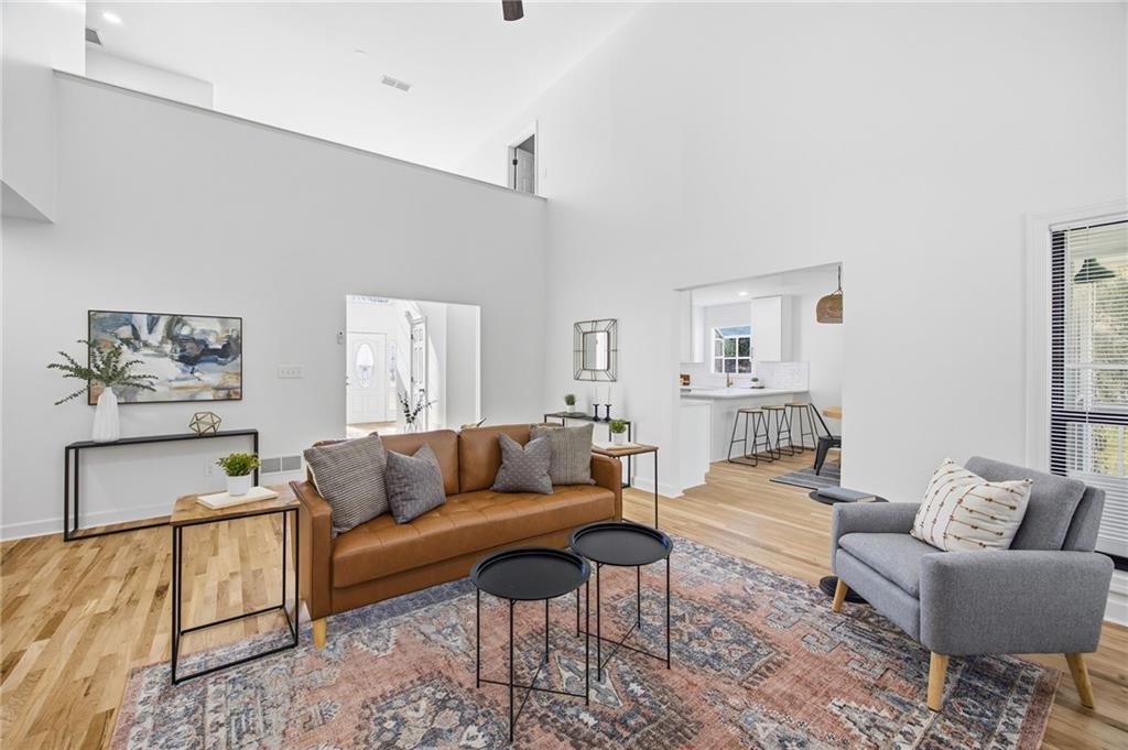 68 Winward Way Southeast Smyrna, GA 30082 - Photo 15 of 42 a living room with furniture and painting on the wall