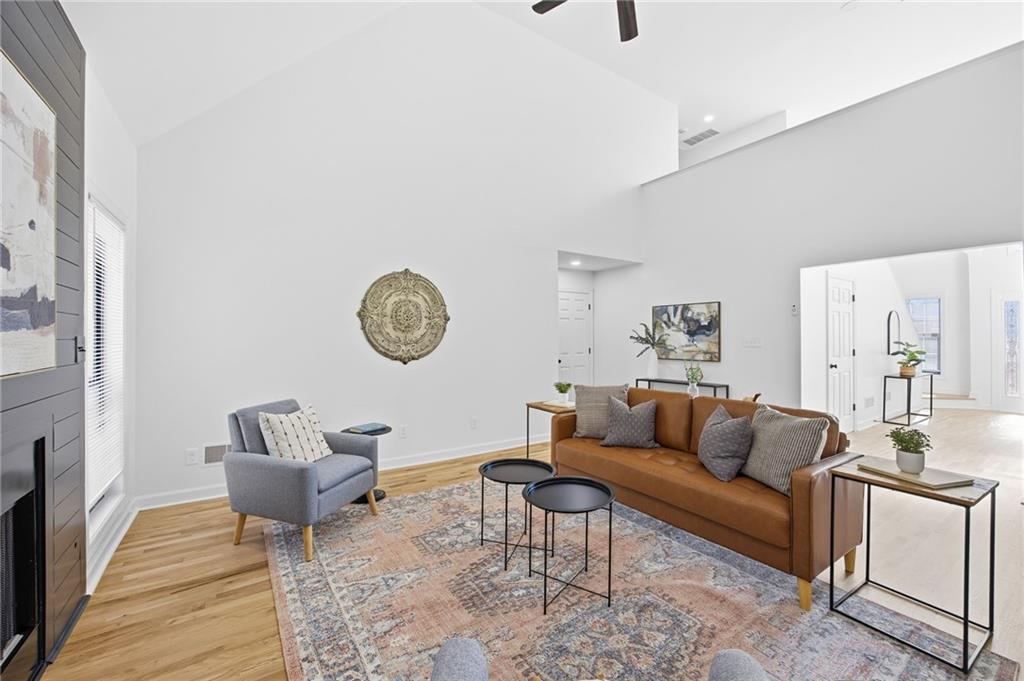 68 Winward Way Southeast Smyrna, GA 30082 - Photo 17 of 42 a living room with furniture a rug and a clock