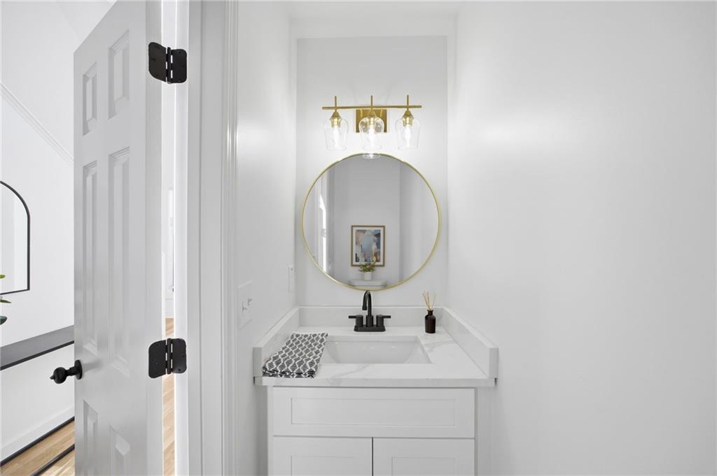68 Winward Way Southeast Smyrna, GA 30082 - Photo 18 of 42 a bathroom with a sink and a mirror