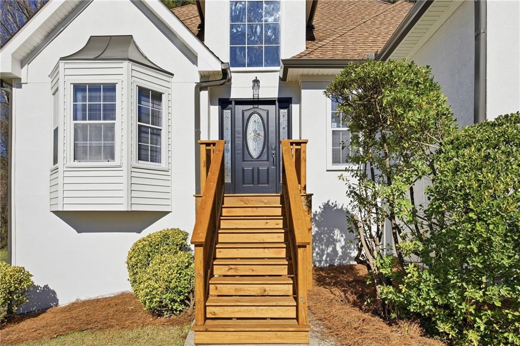 68 Winward Way Southeast Smyrna, GA 30082 - Photo 2 of 42 a front view of a house with a yard