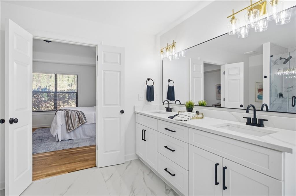 68 Winward Way Southeast Smyrna, GA 30082 - Photo 21 of 42 a en suite bathroom with double sink and a mirror