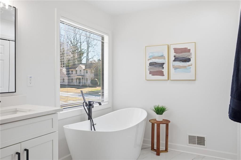 68 Winward Way Southeast Smyrna, GA 30082 - Photo 23 of 42 a living room with furniture and a window