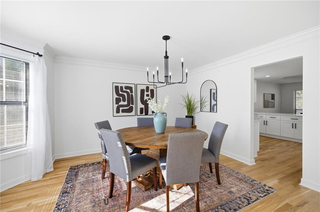 68 Winward Way Southeast Smyrna, GA 30082 - Photo 7 of 42 a view of a dining room with furniture window and wooden floor