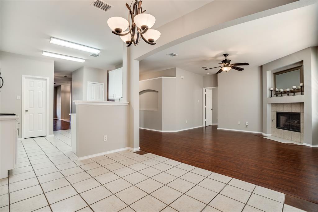 8308 Ram Ridge Road Fort Worth, TX 76137 - Photo 14 of 24 a view of a livingroom with a chandelier furniture and wooden floor