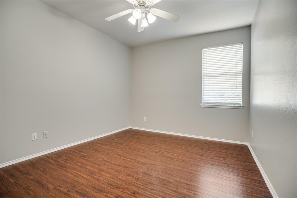 8308 Ram Ridge Road Fort Worth, TX 76137 - Photo 20 of 24 an empty room with wooden floor and windows